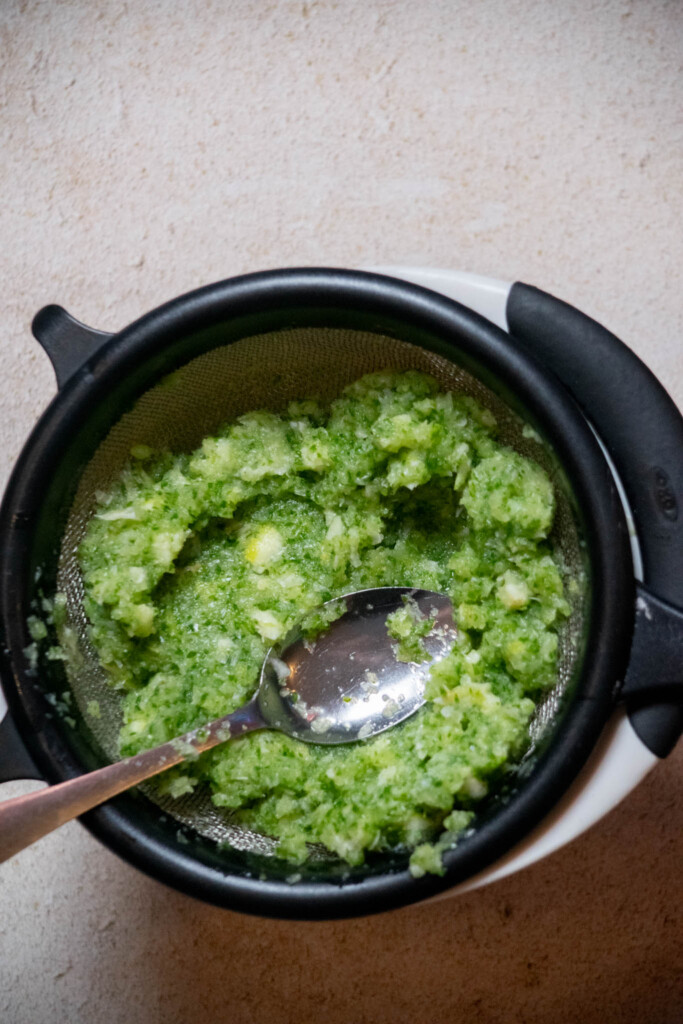 place a fine mesh strainer over a large bowl, and strain liquids to remove pulp, pressing gently to express all liquid into the bowl 