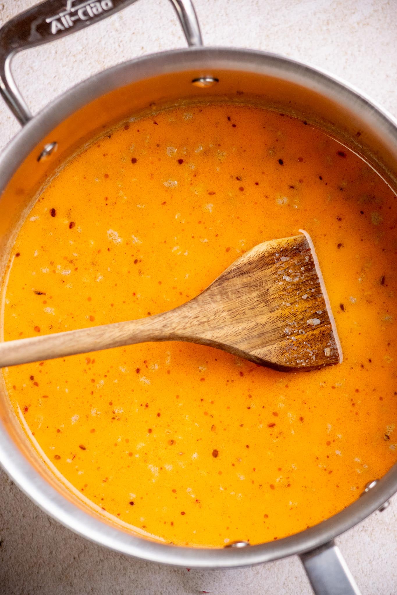 Stir or whisk in the milk gradually until fully incorporated.