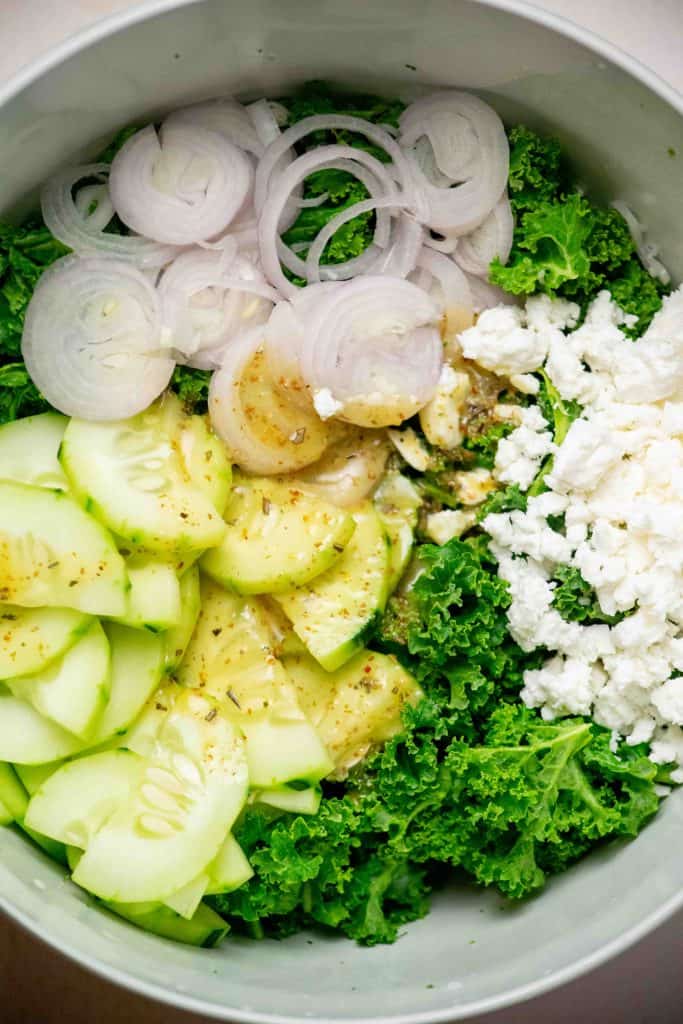 prepare dressing, and add to the bowl with cucumbers, shallot, and feta