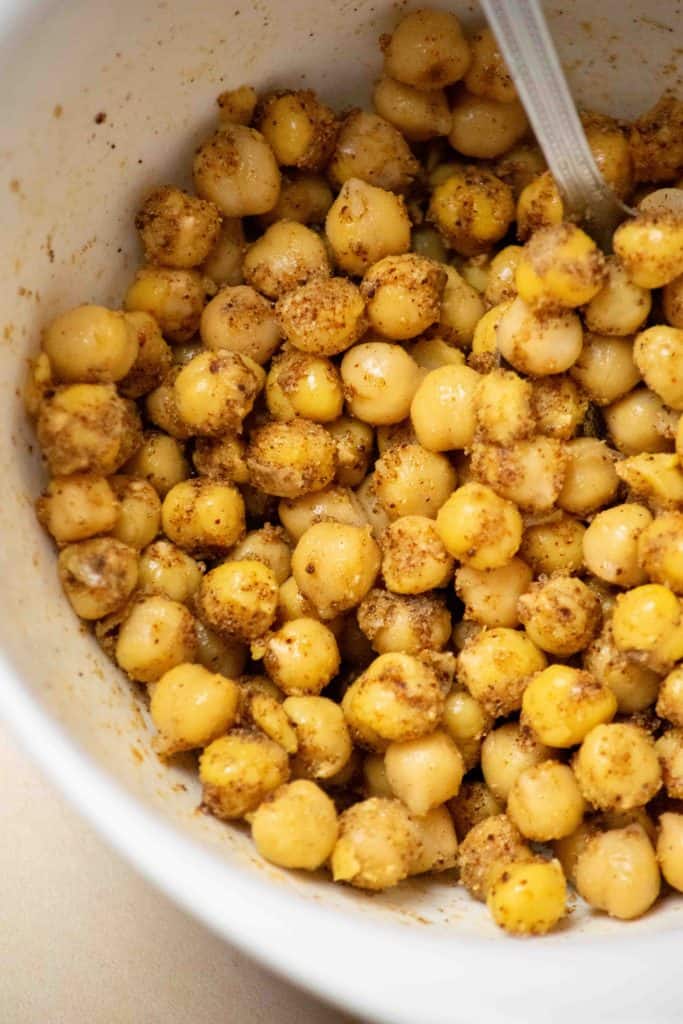 toss peeled chickpeas in oil and seasonings