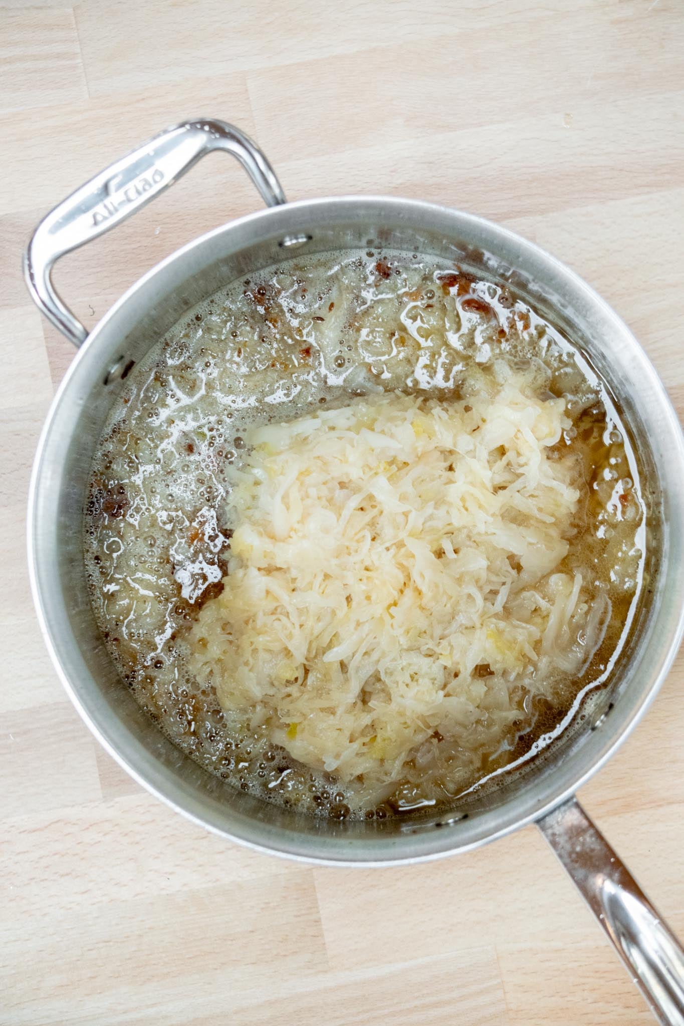 Add beer and bacon, cover, and simmer on low heat for 30 minutes. 