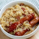 Sauerkraut with bacon and beer, with a side of grilled bratwurst.
