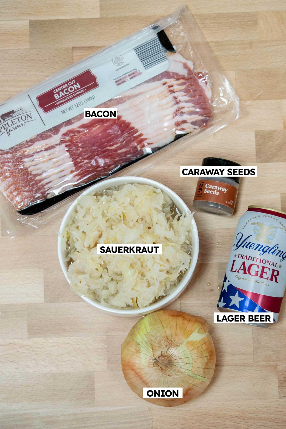 How to cook sauerkraut ingredients- sauerkraut, bacon, onion, beer, caraway seeds. 