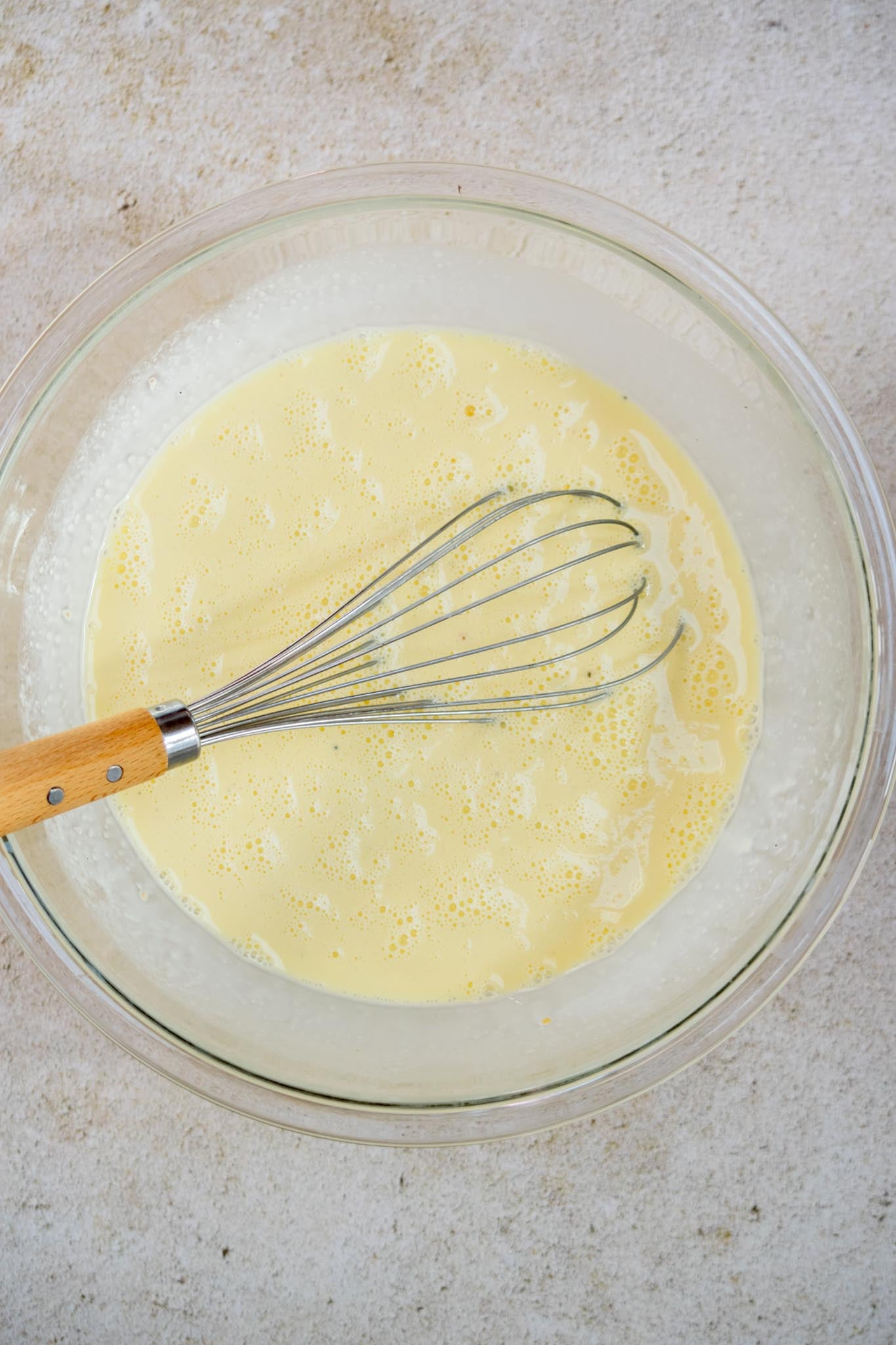 Add the egg mixture. Whisk together the eggs, heavy cream, garlic powder, salt and pepper. Pour evenly over the croissants and sausage.