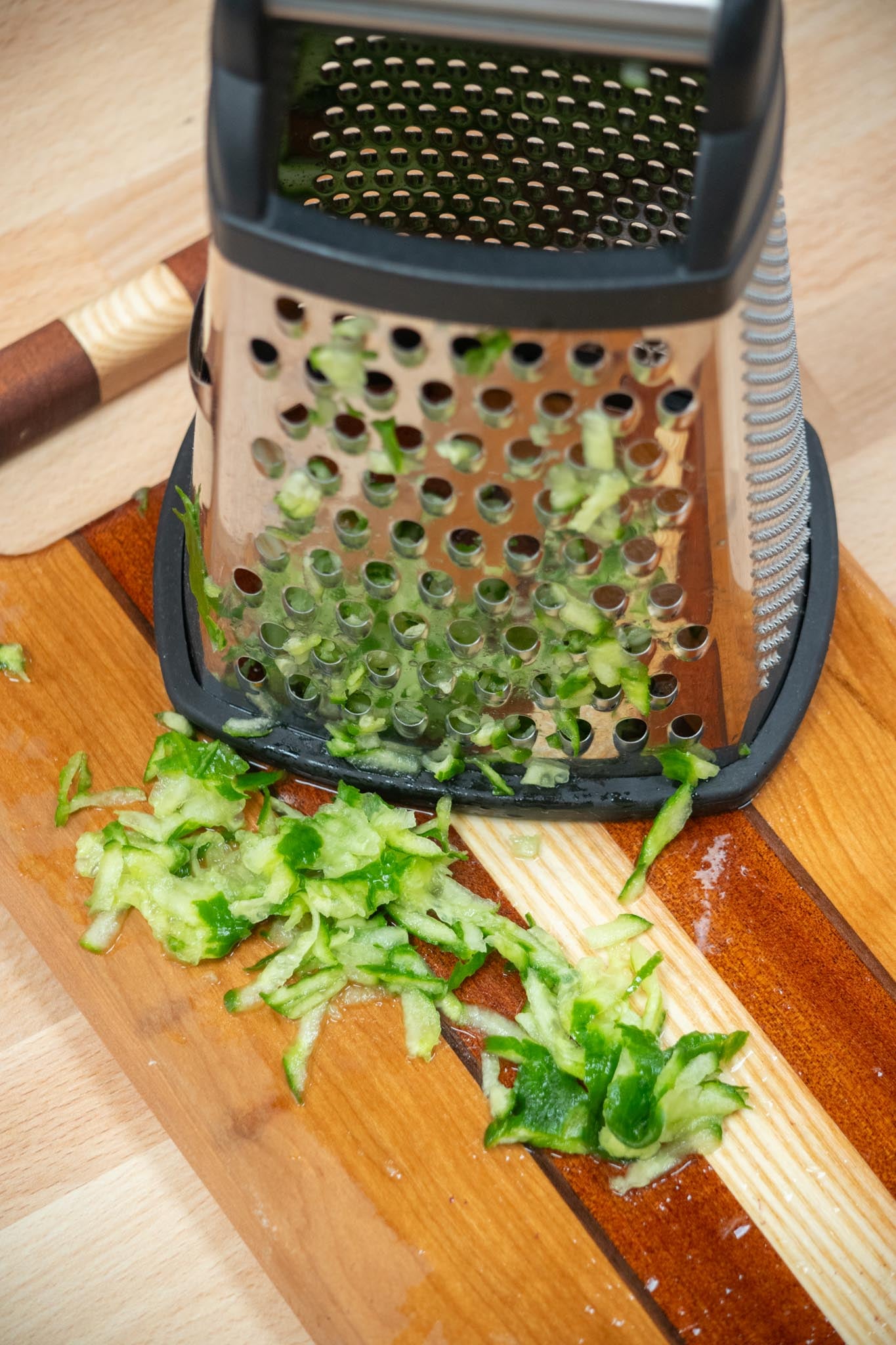 Grate your cucumber over the large holes of a box grater.