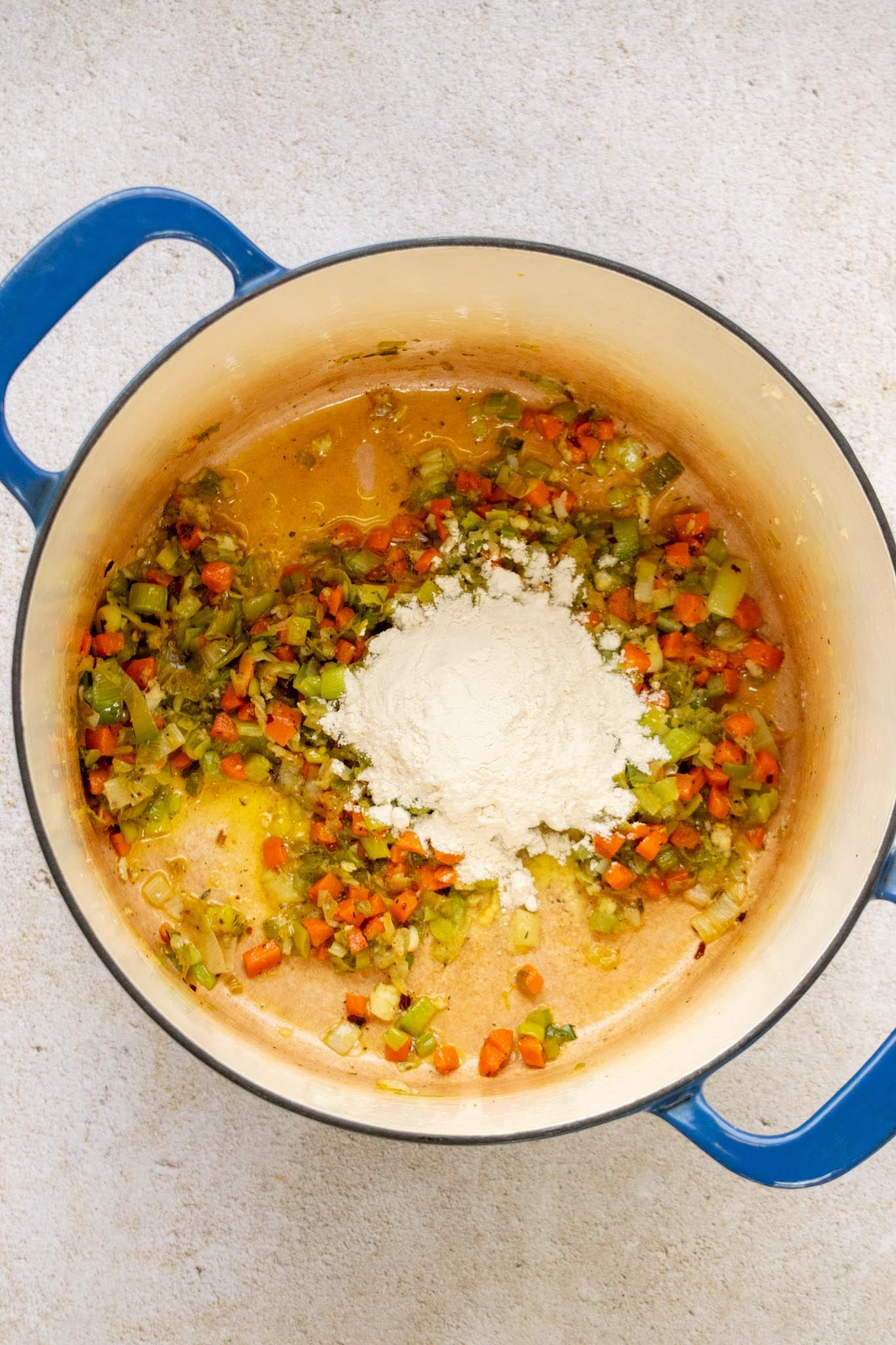 Make the soup base. Sprinkle in the flour and cook for 2 minutes, stirring occasionally. Slowly whisk in the chicken stock until smooth, then stir in the water.