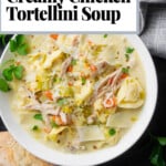 Pinterest graphic for creamy chicken tortellini soup with leeks, shredded chicken, carrots, Parmesan, and crusty bread.