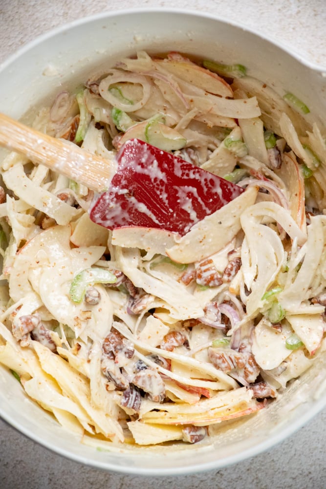 toss the salad with the dressing until well coated