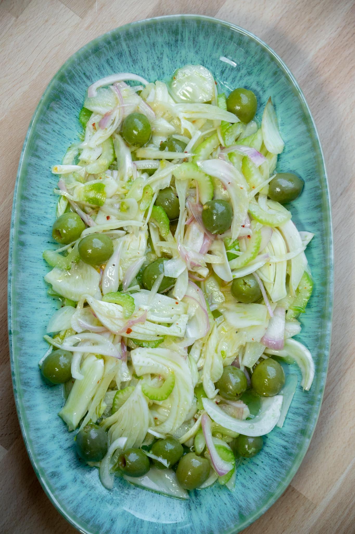 Arrange dressed fennel mixture on.a platter.
