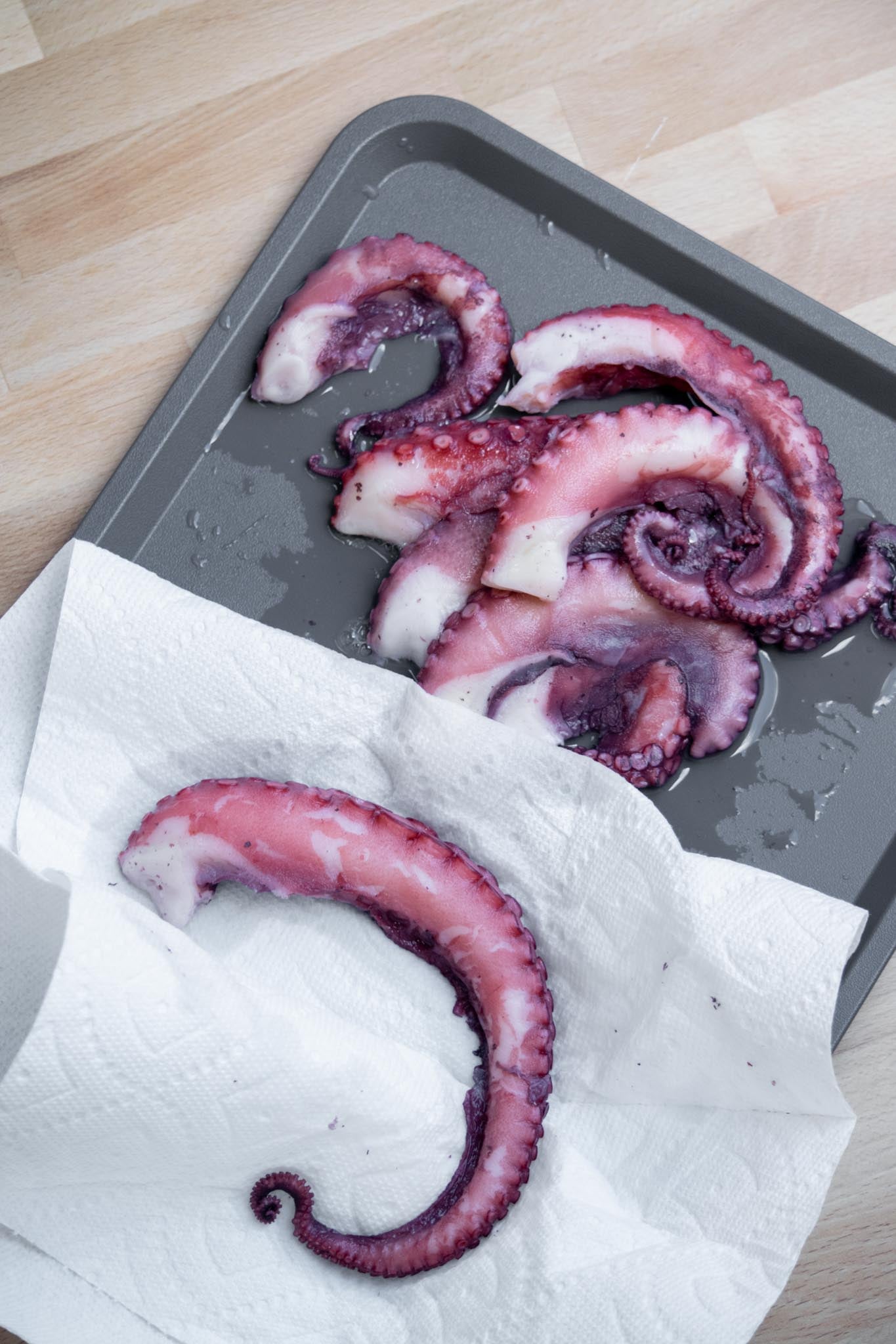 Pat octopus dry with paper towels.