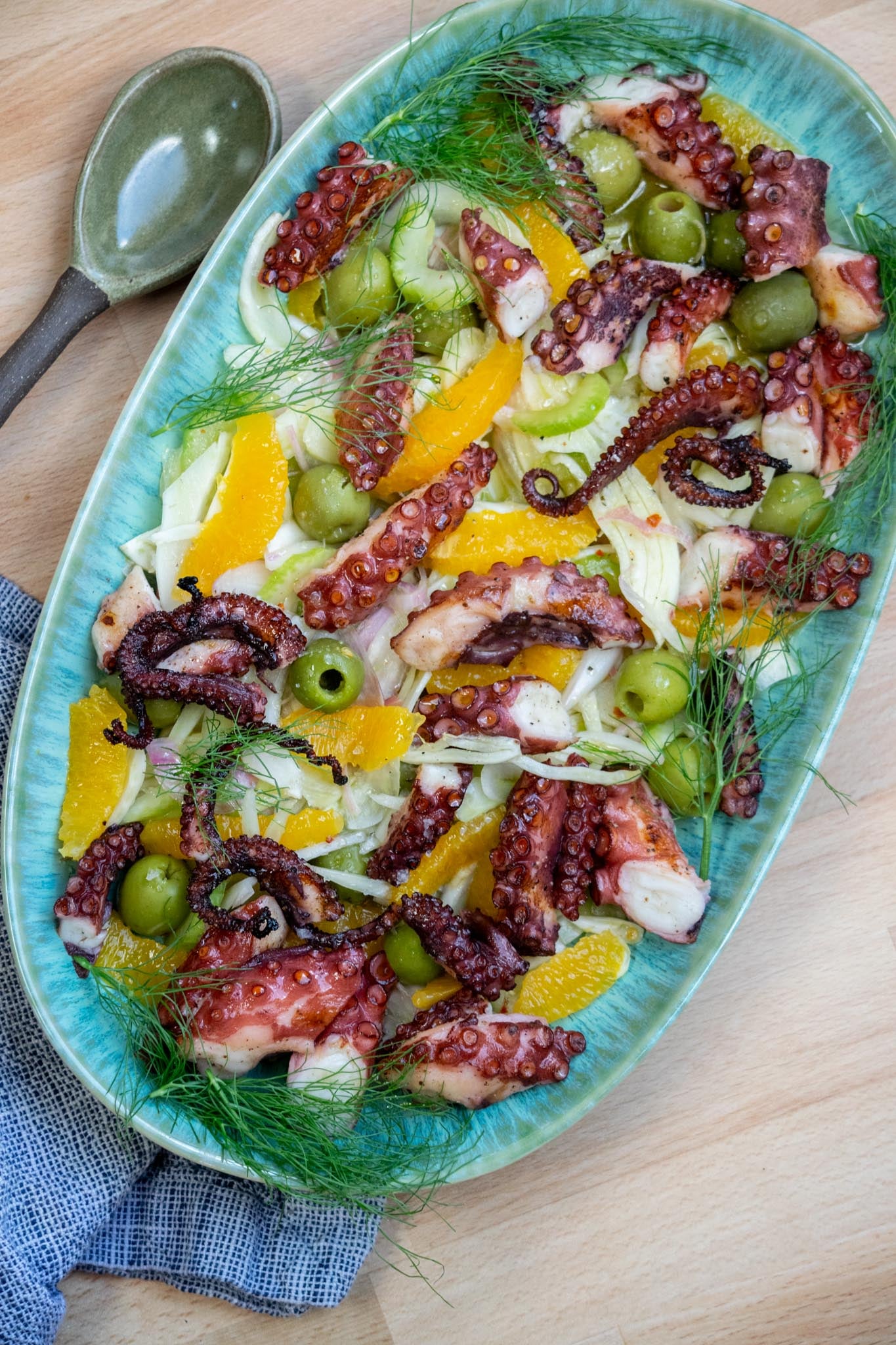Cut octopus into small pieces and arrange over top. Garnish with fennel fronds, a drizzle of olive oil and flakey sea salt, if desired.