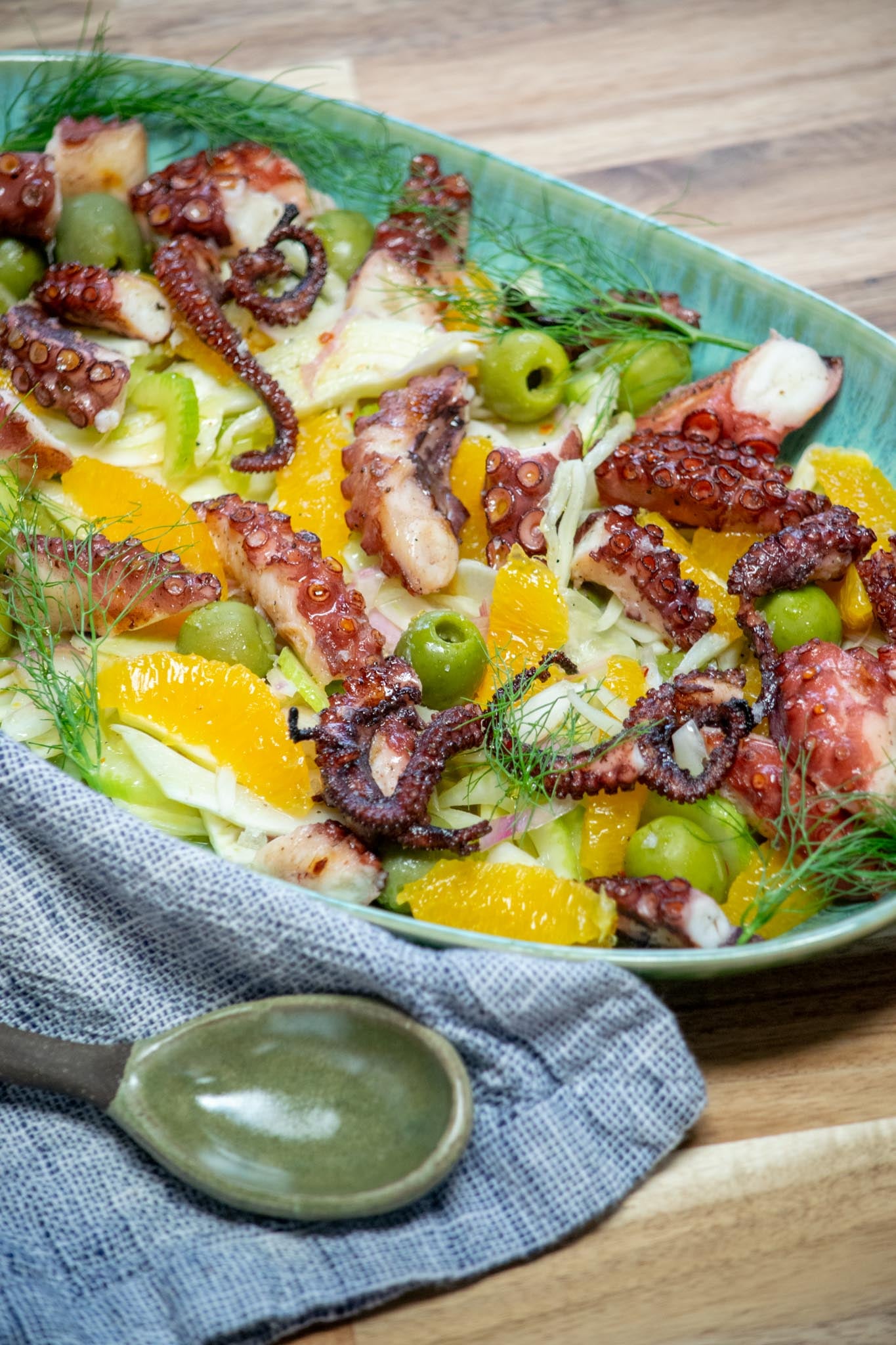 Octopus Salad on a platter with fennel fronds.