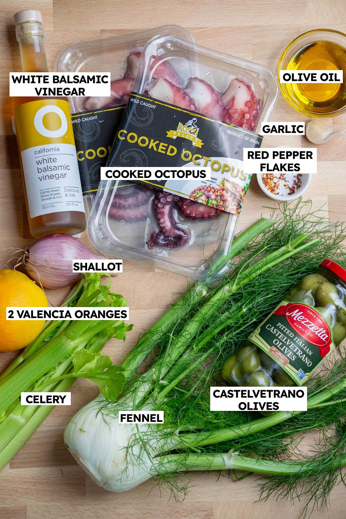 Octopus Salad recipe ingredients: fennel, oranges, olives, shallot, octopus, olive oil, garlic, white balsamic vinegar, celery, red pepper flakes.
