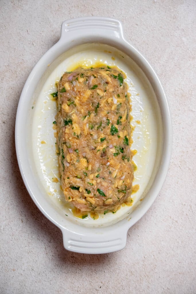 grease your casserole dish, or spray with cooking spray, and form the meatloaf with your hands into a uniform loaf, leaving a 1-2" gap around the sides.