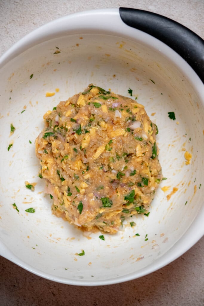 mix with your hands, until just combined- being careful not to over-mix, which can result in a tough meatloaf. 