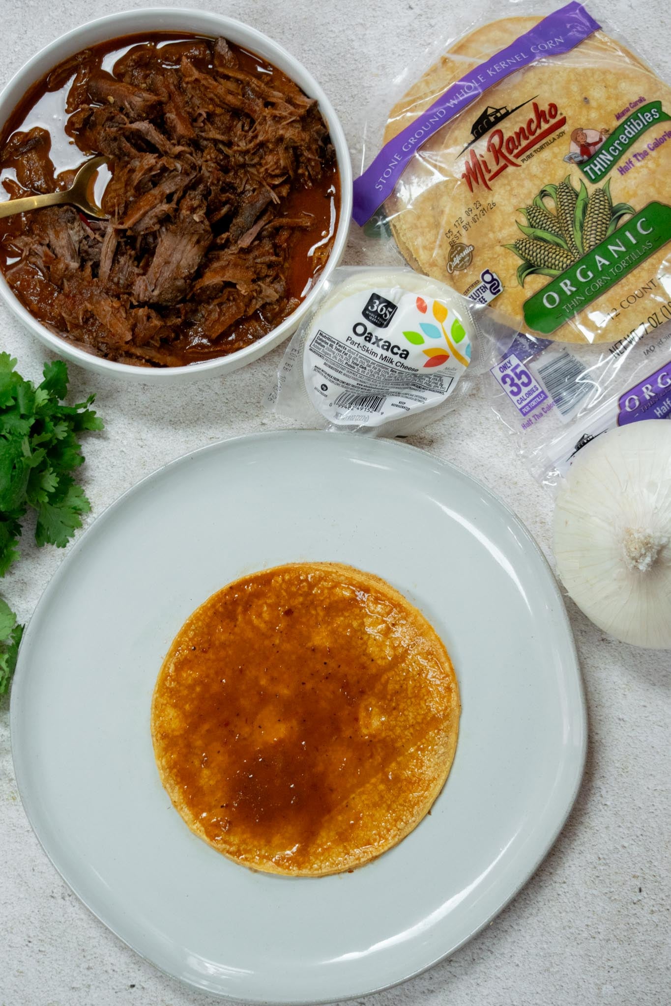 Dip your tortillas. Dip the tortillas into the consommé until lightly coated.