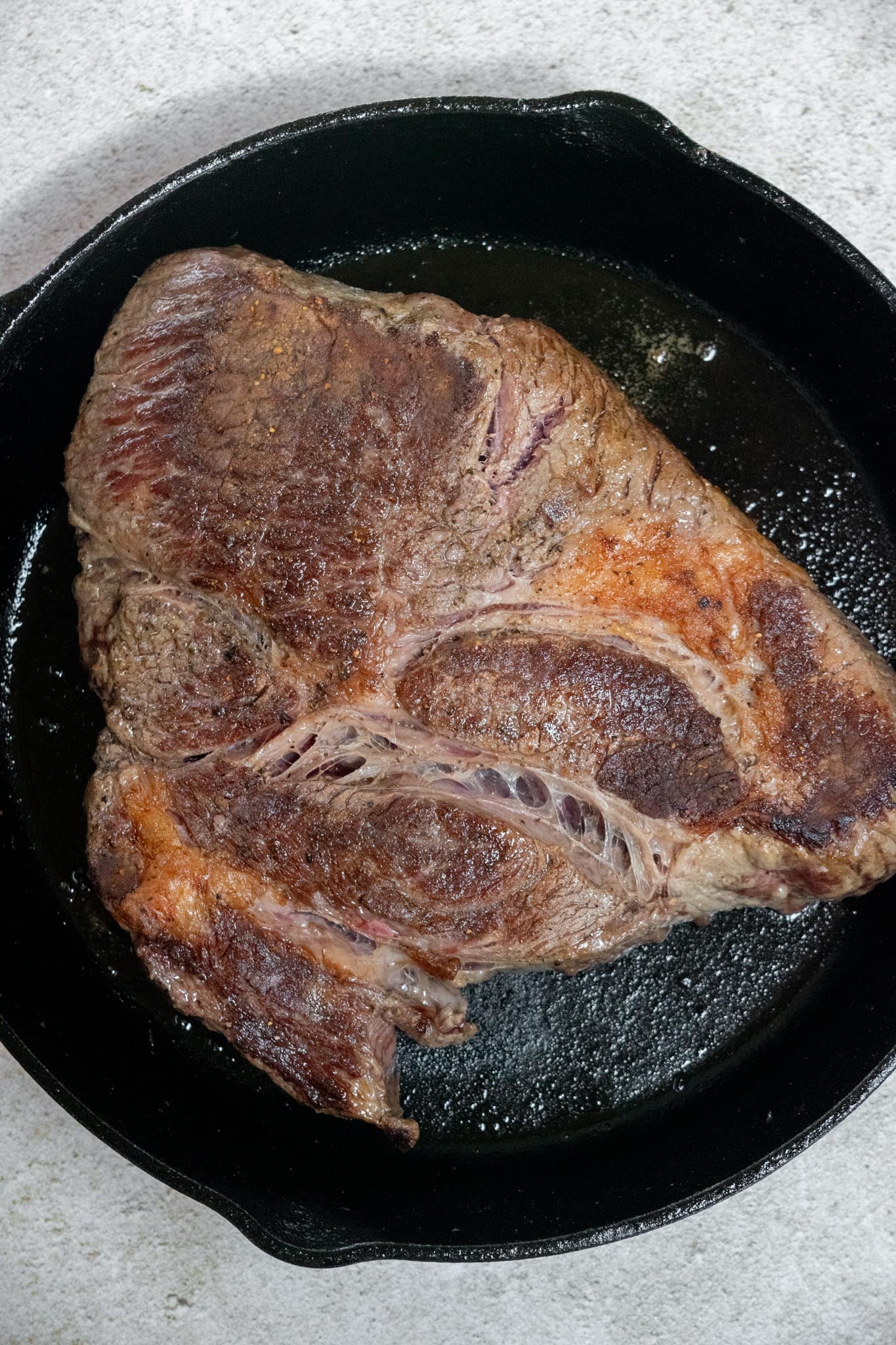 Sear the beef. Season the chuck roast and brown it on all sides in a hot skillet to build deeper flavor.