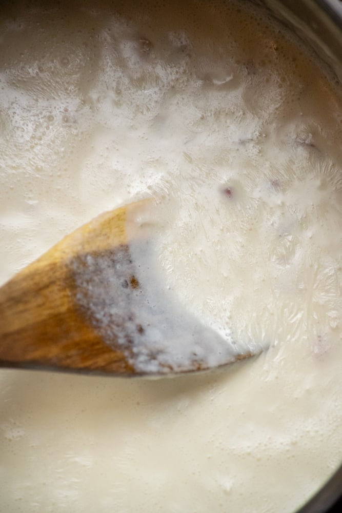 slowly whisk in heavy cream and half and half