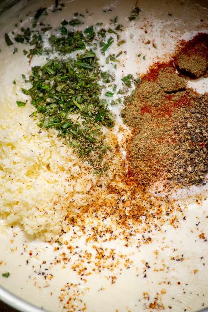 stir in asiago, rosemary and dried spices, and allow to cool