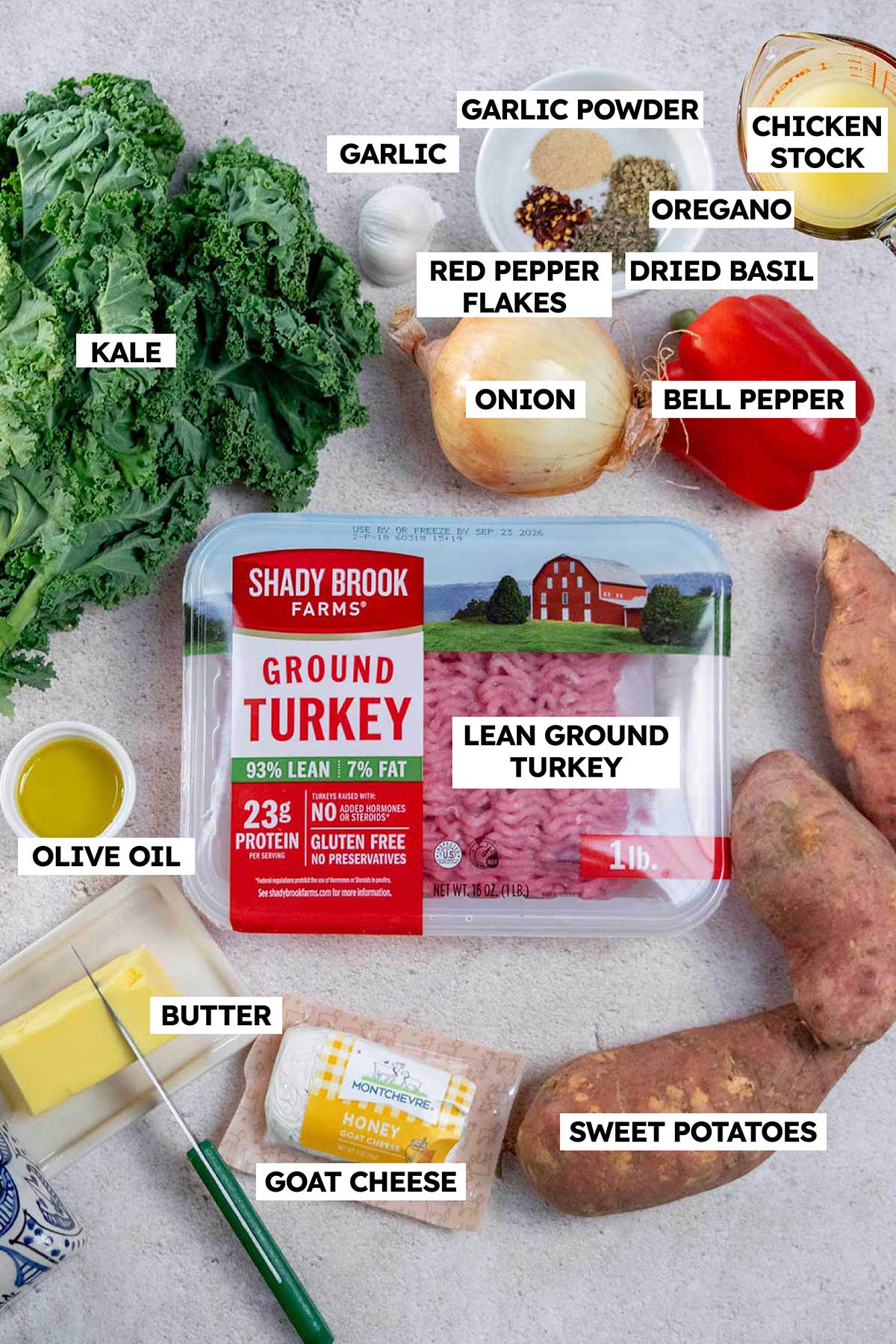 Ingredients for ground turkey skillet meal with sweet potatoes, kale, bell peppers and goat cheese.