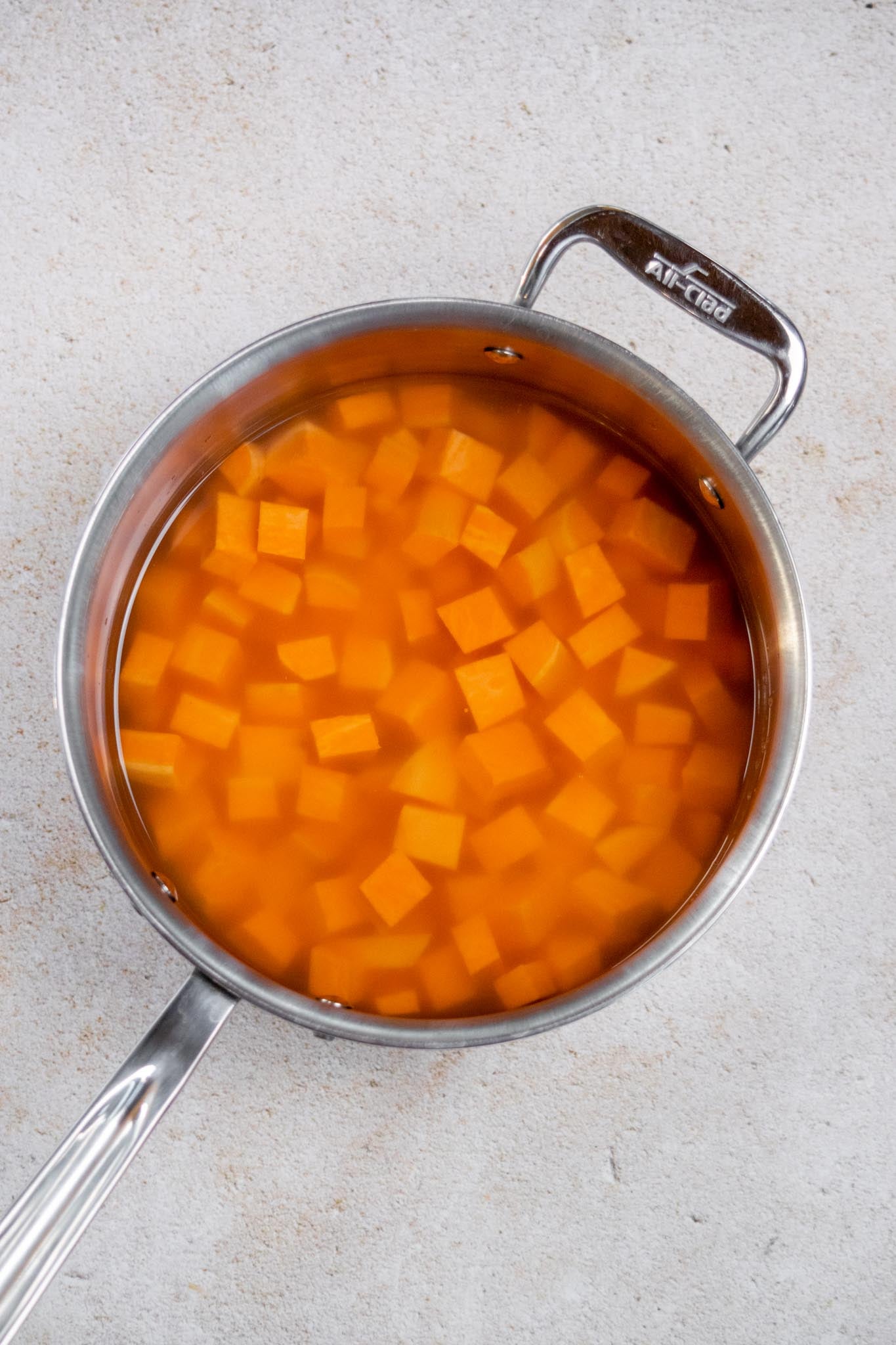Par-boil the sweet potatoes. Cut the sweet potatoes into ½-inch pieces and add them to a small saucepan. Cover with water, bring to a boil, then reduce the heat and simmer for 4–6 minutes, until just fork-tender. Drain and set aside.