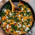 Ground turkey skillet meal with sweet potatoes, kale and goat cheese in a large skillet.