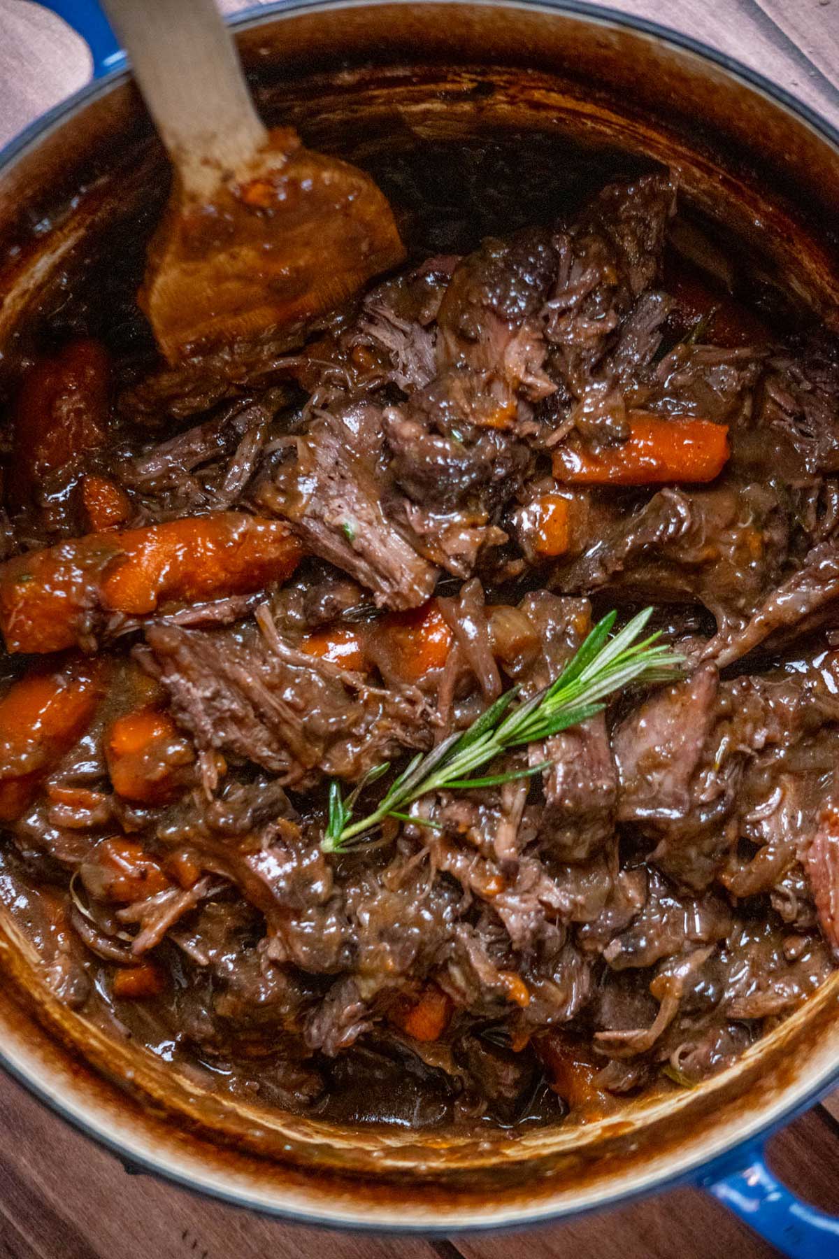Return the shredded beef to the Dutch oven and toss to coat evenly in the braising liquid or gravy.