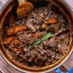 Dutch oven chuck roast with carrots and gravy.