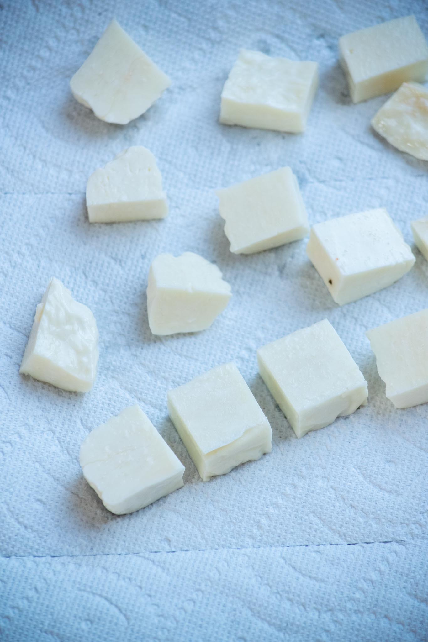 Cut halloumi into 1" squares, and dry well with paper towels to promote browning. 
