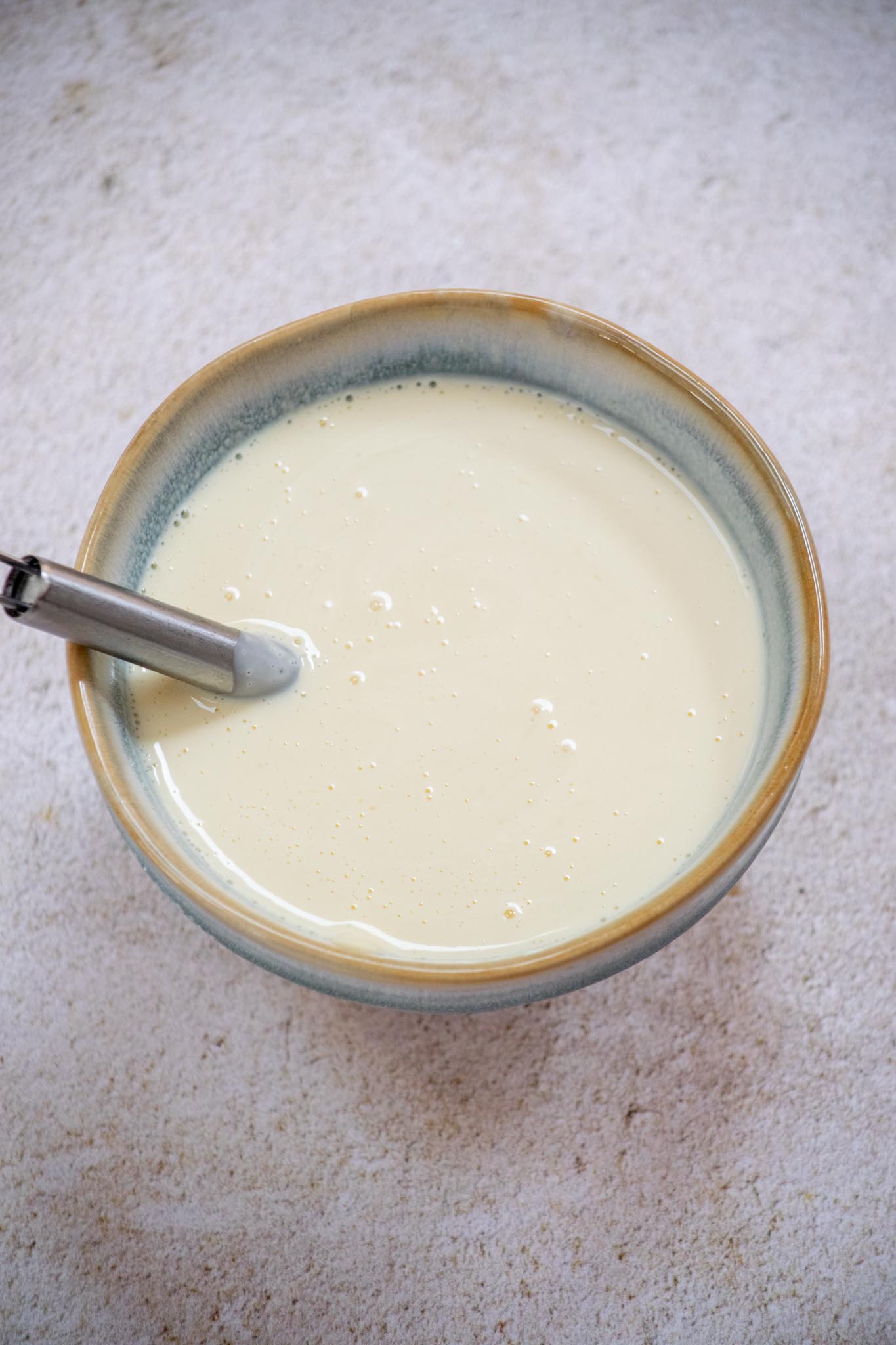 Whisk together mayonnaise, sugar, and vinegar until smooth. 
