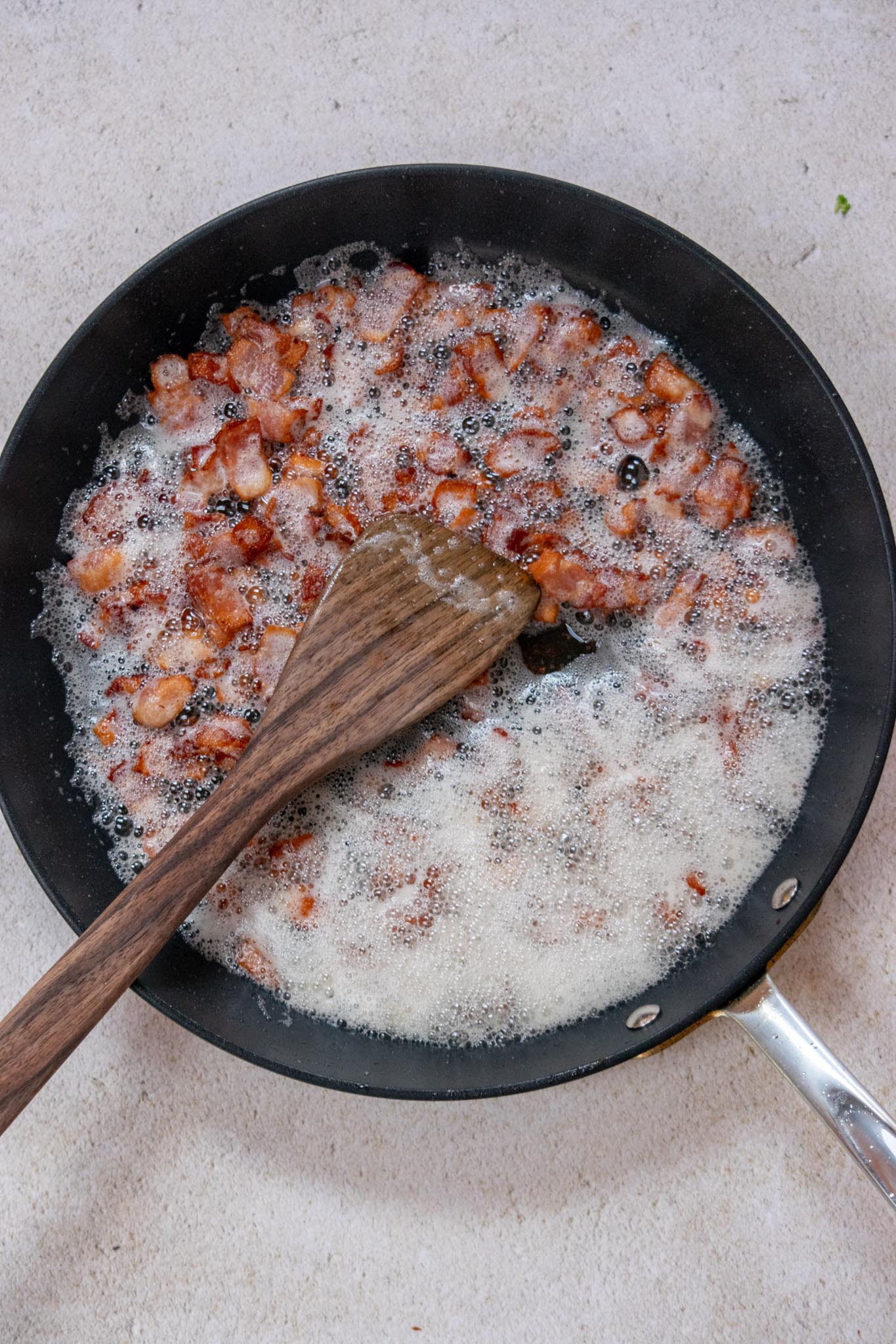 Chop the bacon into small pieces and cook over medium-low heat, stirring occasionally until crisp-around 15 minutes.