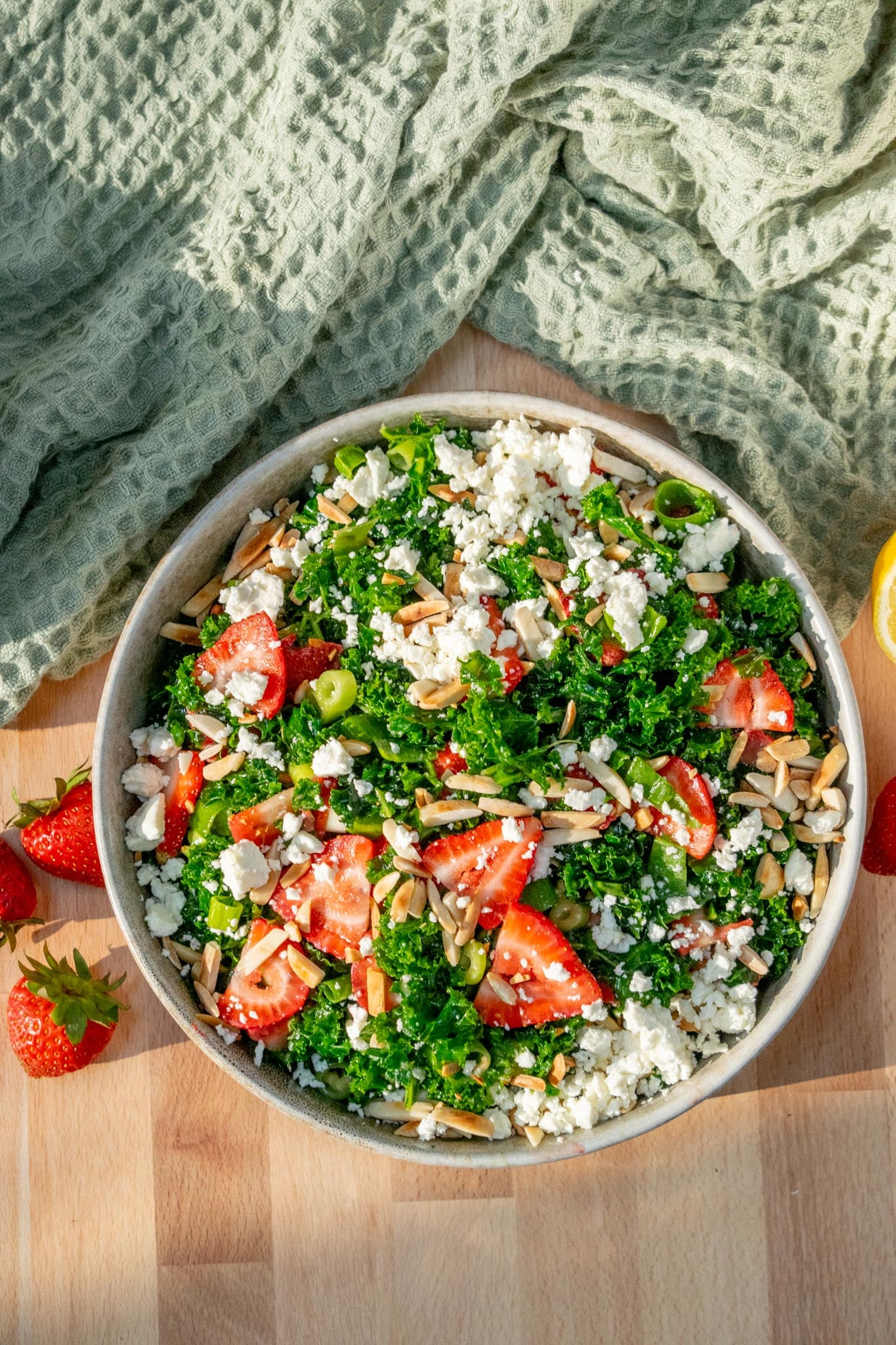 Top with cooled toasted almonds and feta.