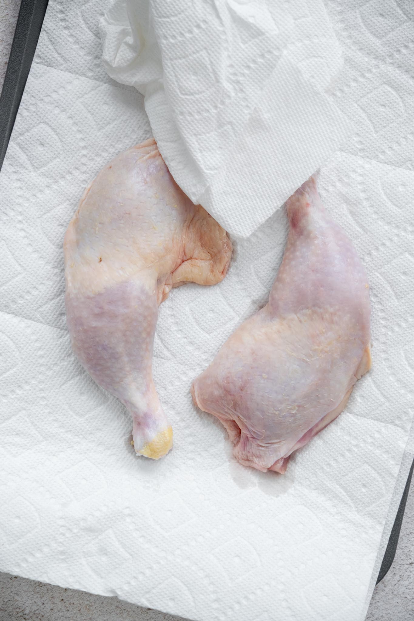 Dry chicken leg quarters well with paper towels to promote even browning and crispiness. 