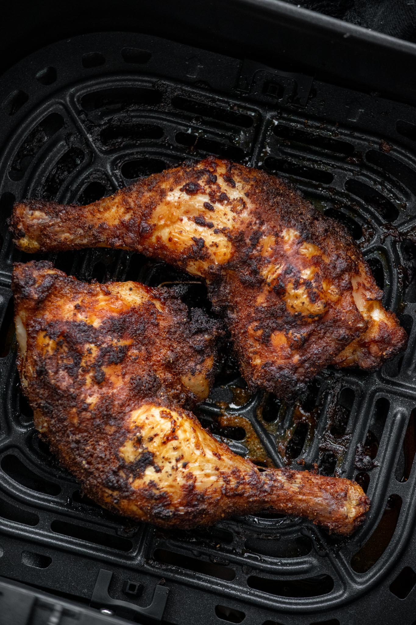 Remove chicken leg quarters from the air fryer basket, and allow to rest for -10 minutes before serving the allow the juices to redistribute. 