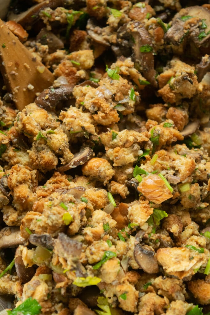 Add the toasted bread to the bowl, and gently fold the toasted bread cubes into the mixture until well coated.