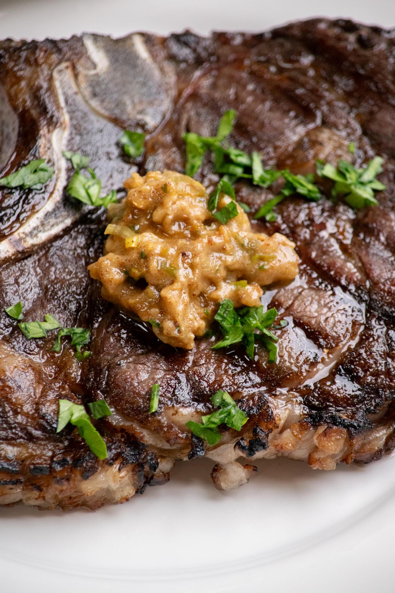 Anchovy Butter melting on grilled steak.