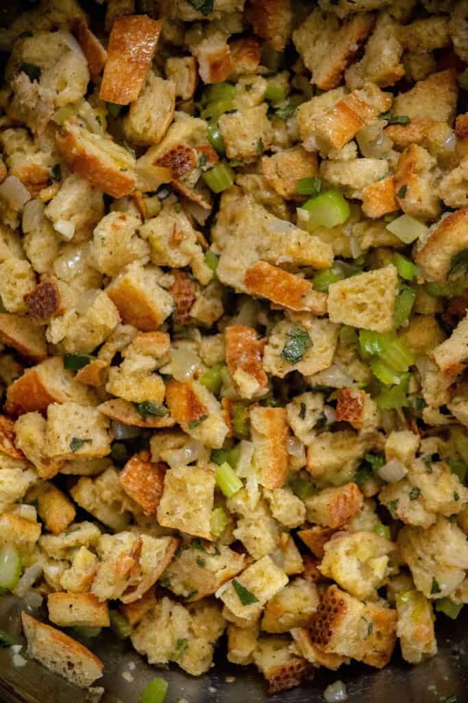 Add it to a LARGE bowl with the eggs, toasted bread, seasoning and chicken stock, and mix well before adding to the greased and preheated crockpot.