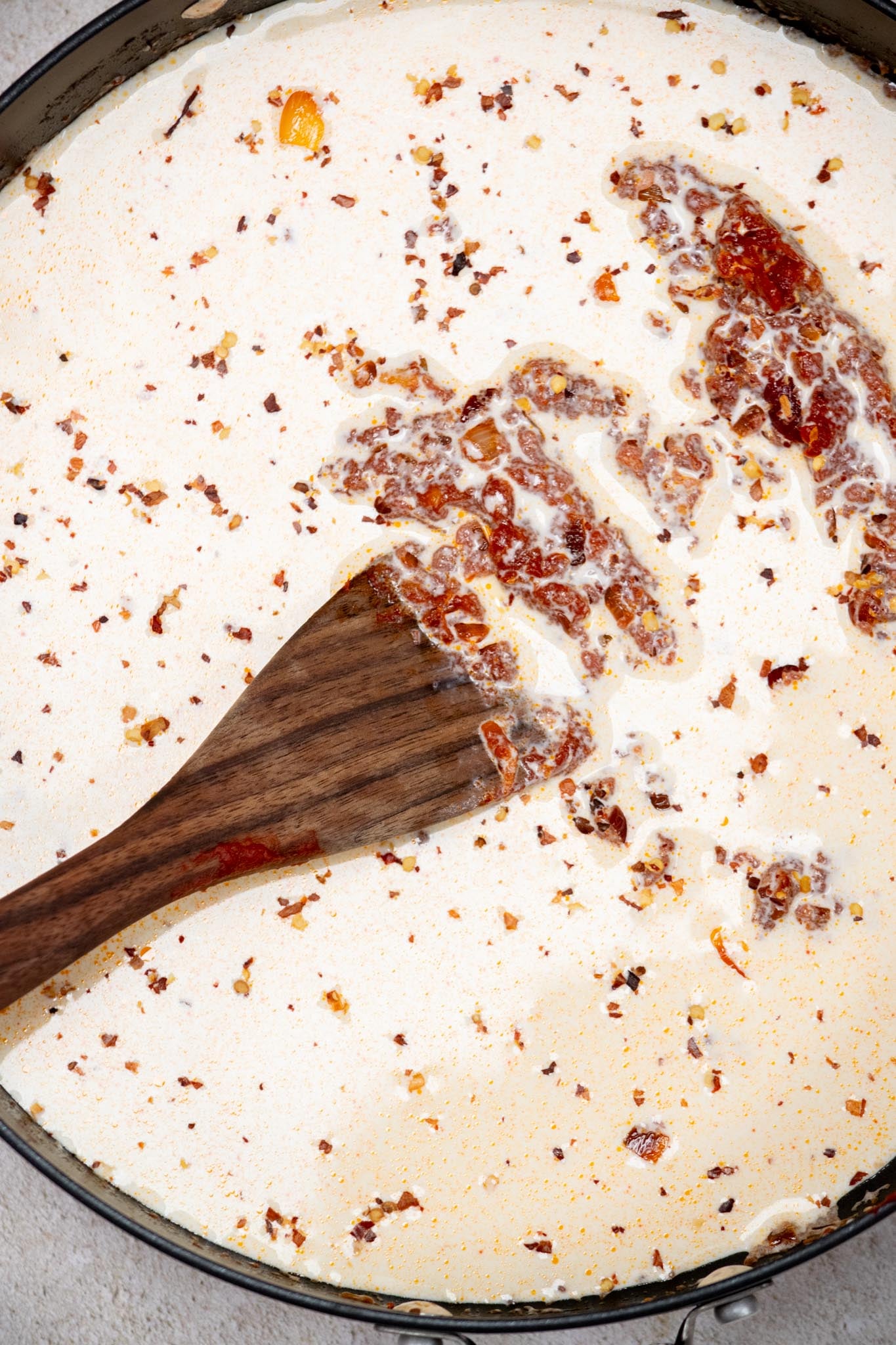 Add heavy cream and red pepper flakes; cook 2–3 minutes, stirring occasionally, until slightly thickened.