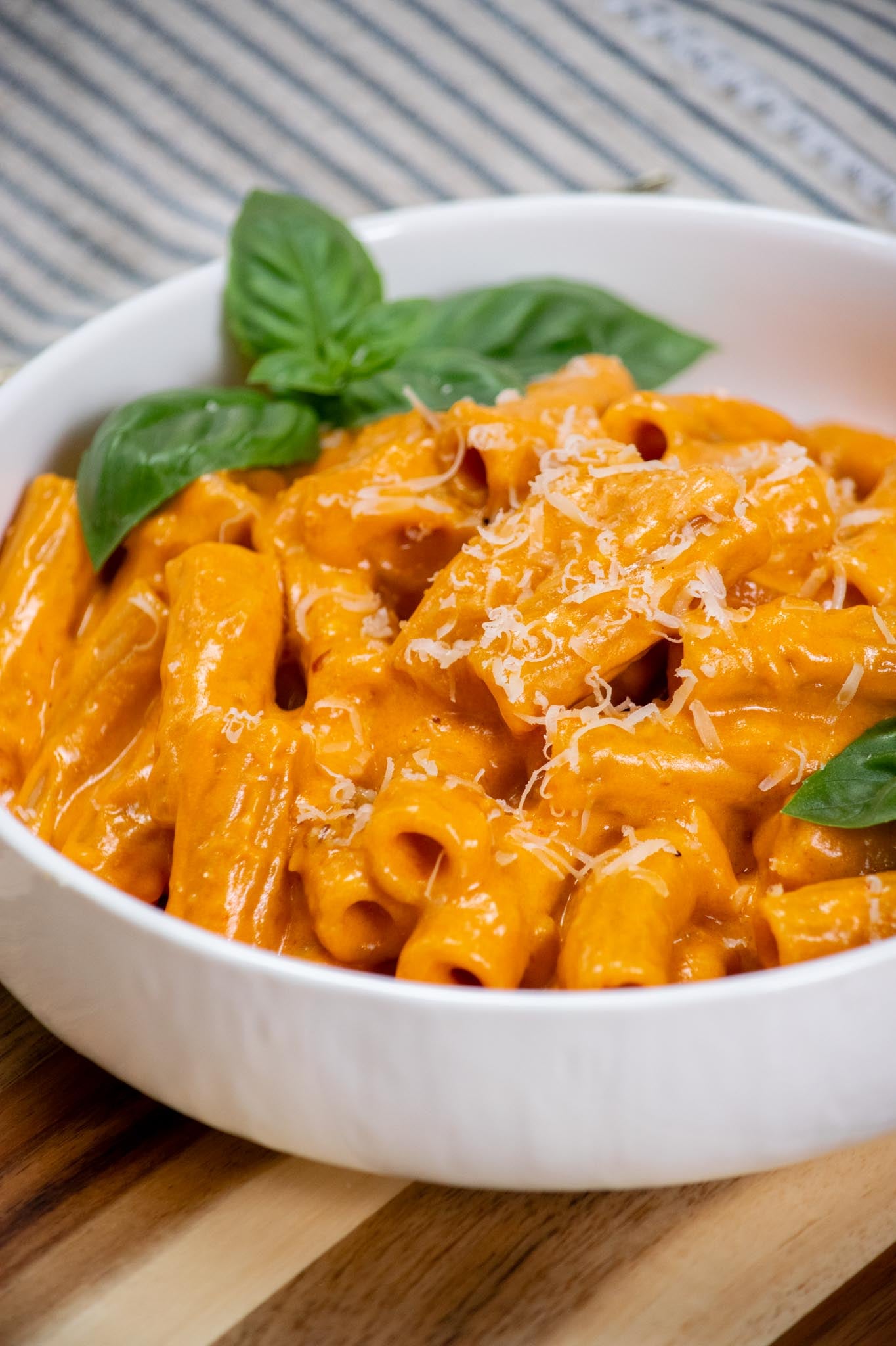Serve topped with fresh basil and extra Parmesan, if desired.