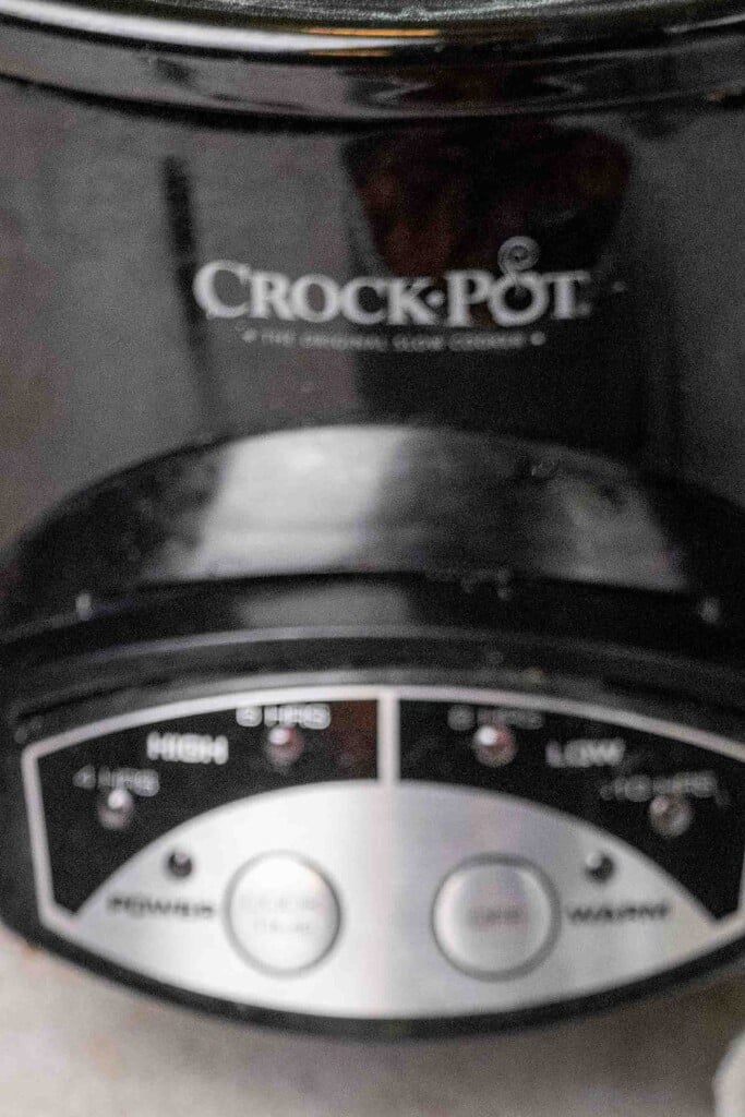 Preheat oven to 400 degrees to toast the bread, and grease your crockpot with butter, then preheat crockpot to high for 20 minutes. This helps build a nice crust on the stuffing.