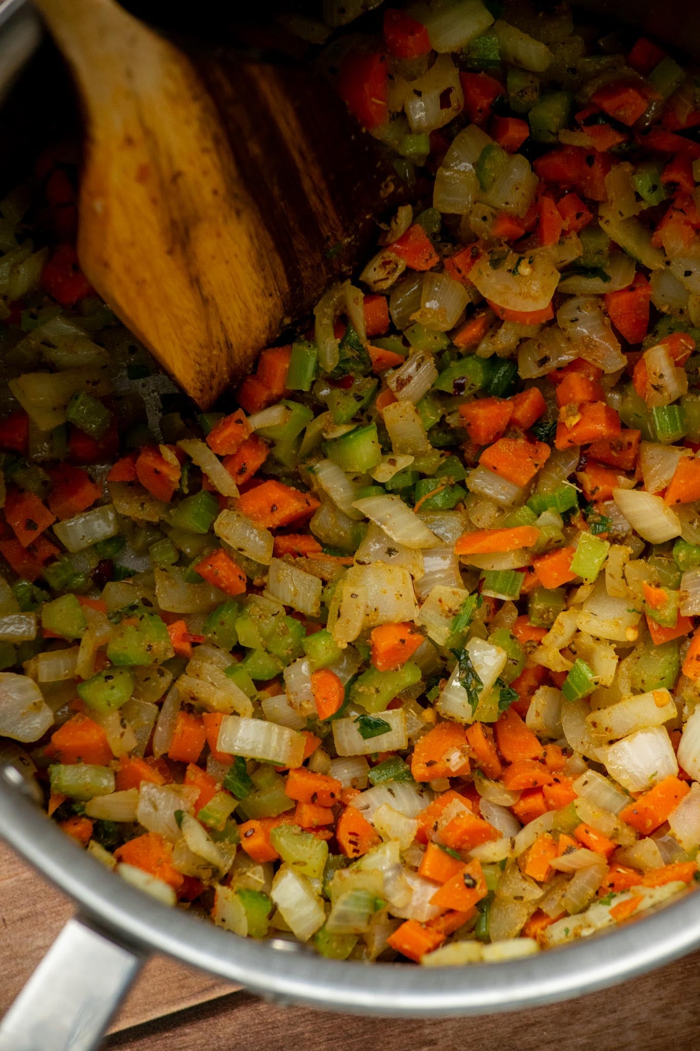 Add the seasonings. Stir in the cumin, oregano, basil, garlic powder, crushed red pepper flakes, salt, and pepper. Cook for about 1 minute, until fragrant.