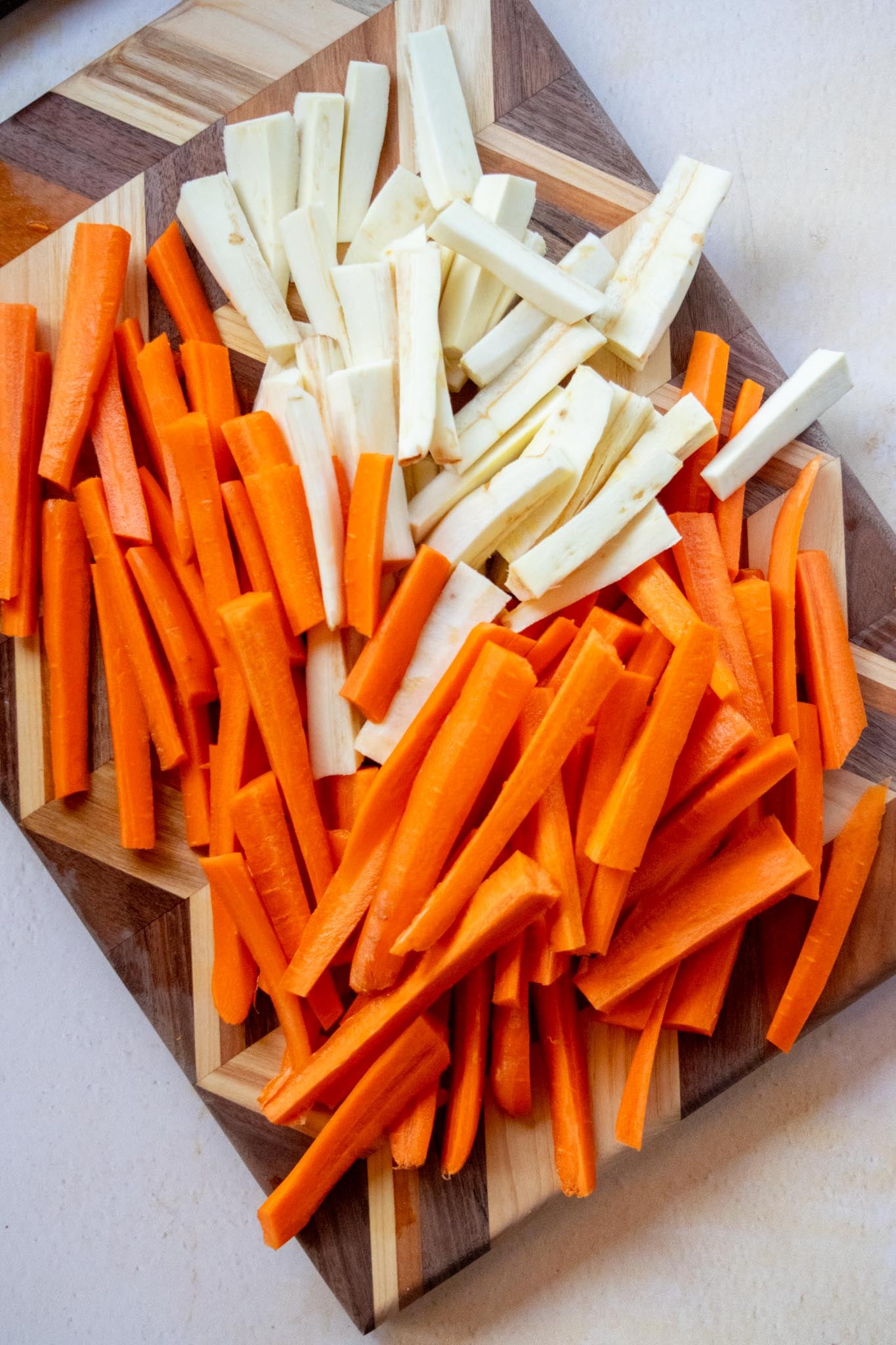 Prep the vegetables. Cut the carrots and parsnips into evenly sized pieces so they roast at the same rate.