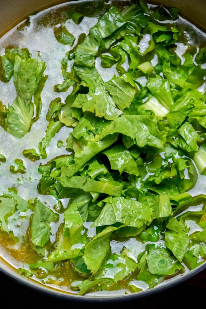 add chopped escarole, cover, and cook an additional 5-10 minutes, until tender.