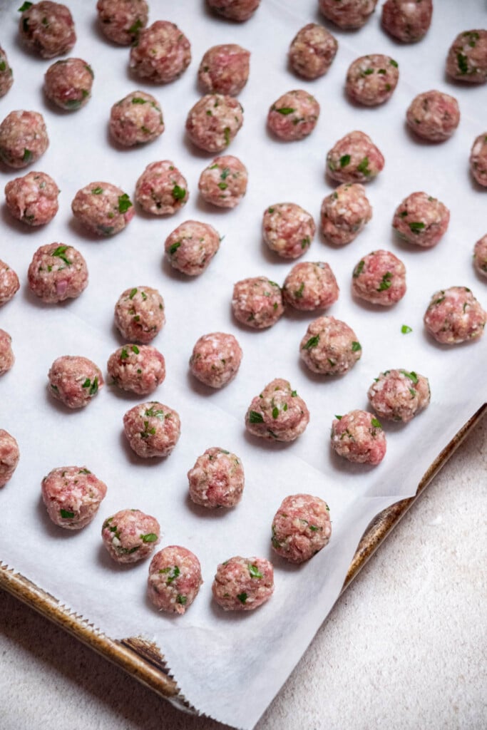 use a teaspoon measure to scoop them meatballs into a uniform size, and form them gently into balls with your hands.