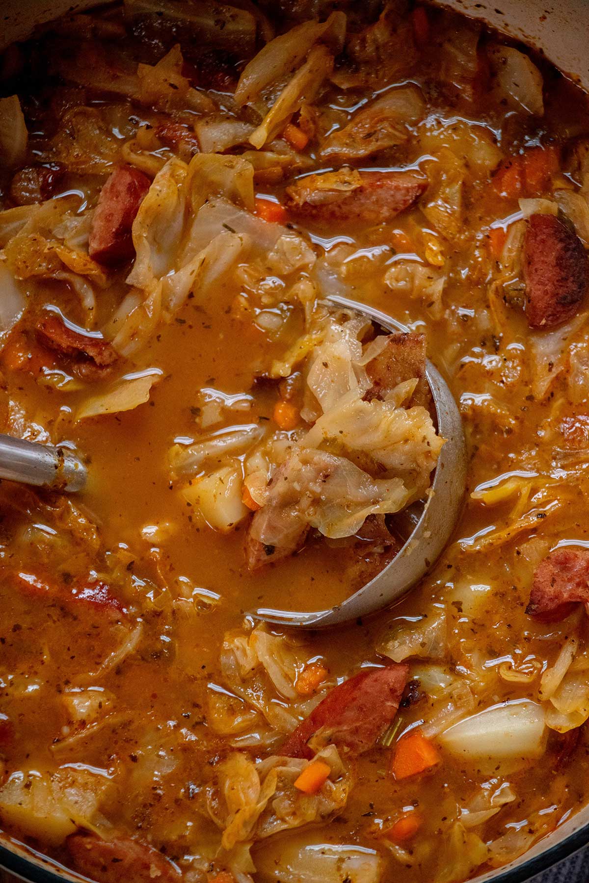 Remove the bay leaves, stir in the red wine vinegar, and taste for salt and pepper before serving.
