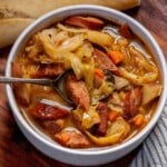 Cabbage soup with sausage made with kielbasa, green cabbage, red potatoes and carrots in a savory broth.
