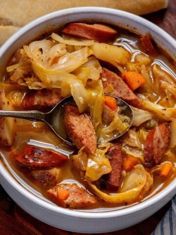 Cabbage soup with sausage made with kielbasa, green cabbage, red potatoes and carrots in a savory broth.
