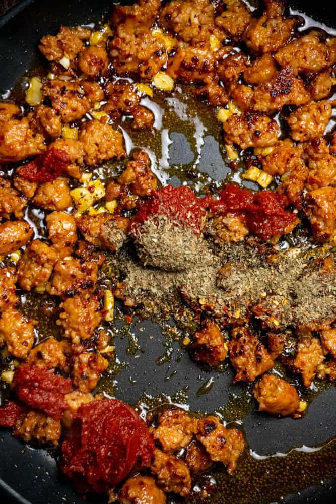 Add garlic; cook 1 minute. Stir in spices and tomato paste.