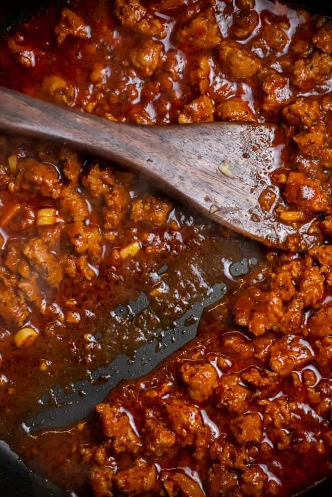 Simmer until wine is mostly reduced.