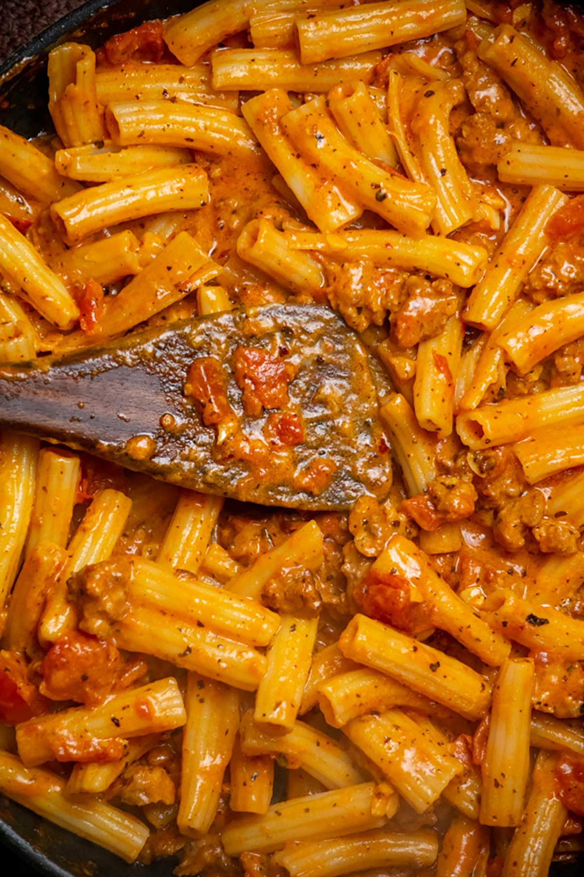 Add pasta, Parmesan, and a splash of pasta water. Toss to coat.